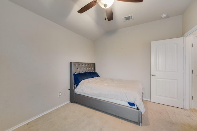 bedroom with visible vents, lofted ceiling, carpet, and baseboards