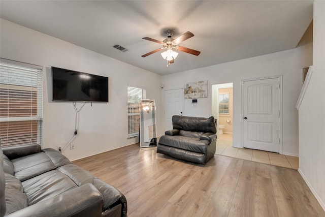 4041 Merriman Dr, Heartland, TX 75126 - living area featuring a ceiling fan, plenty of natural light, light wood-style floors, and visible vents