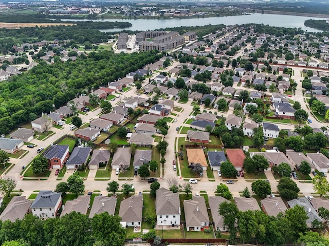 bird's eye view with a water view and a residential view