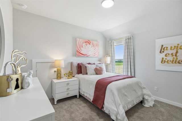 bedroom featuring vaulted ceiling, baseboards, and light carpet