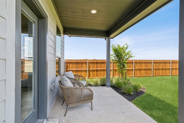 view of patio / terrace featuring fence