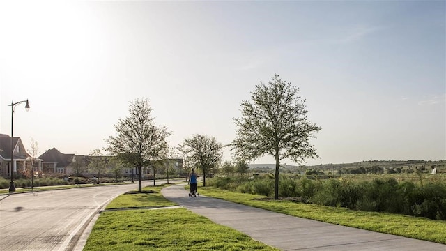 exterior space featuring street lights and sidewalks