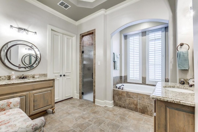 full bathroom featuring visible vents, a stall shower, a sink, crown molding, and a bath