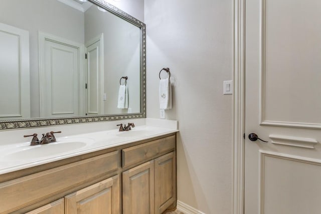 full bathroom featuring a sink and double vanity