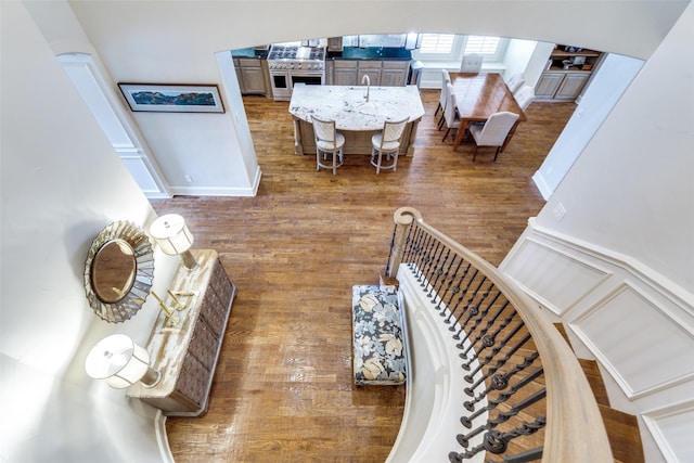 interior space featuring wood finished floors and a decorative wall