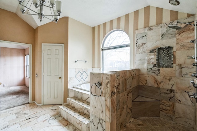 full bathroom with a garden tub, lofted ceiling, marble finish floor, tiled shower, and a chandelier