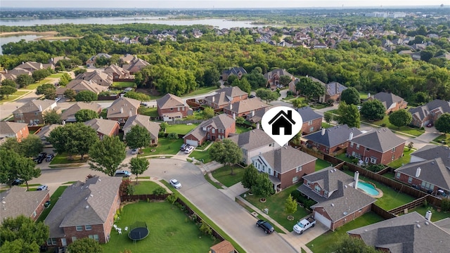 bird's eye view with a residential view and a water view