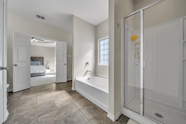 ensuite bathroom with visible vents, a garden tub, a stall shower, ensuite bathroom, and tile patterned flooring