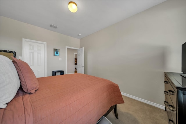 bedroom with visible vents, baseboards, and carpet flooring