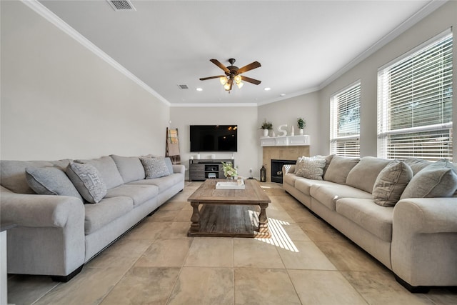 living room with visible vents, light tile patterned flooring, recessed lighting, a fireplace, and ornamental molding