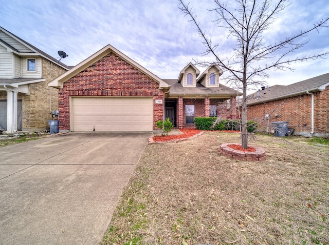 view of front facade featuring concrete driveway, a garage, and brick siding