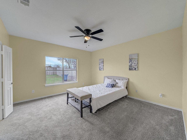 bedroom featuring visible vents, baseboards, carpet, and a ceiling fan