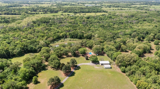 aerial view featuring a wooded view