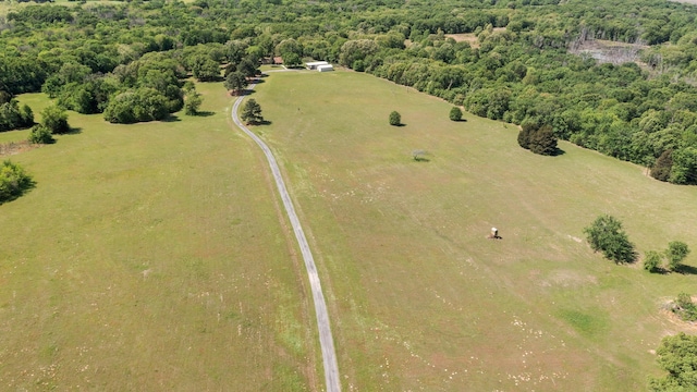 aerial view featuring a wooded view