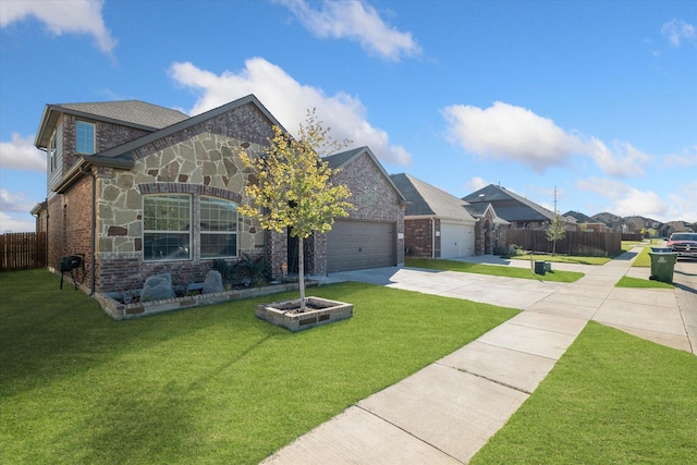 view of front facade with a front yard, fence, driveway, stone siding, and brick siding