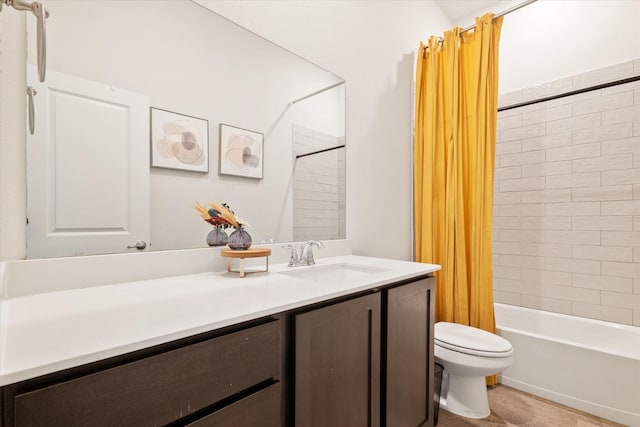 bathroom featuring vanity, toilet, wood finished floors, and shower / bath combo with shower curtain