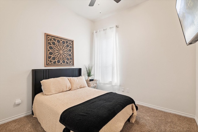 carpeted bedroom with multiple windows, baseboards, and ceiling fan