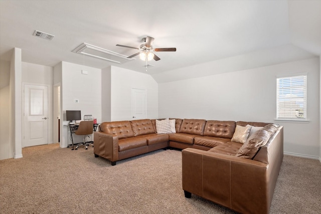 living area featuring attic access, visible vents, lofted ceiling, and light carpet