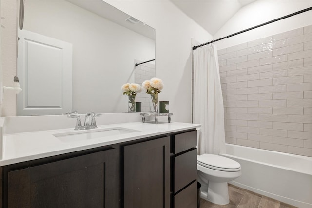 full bathroom with vanity, visible vents, shower / bath combination with curtain, vaulted ceiling, and toilet