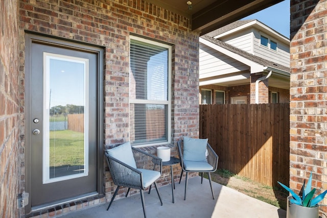 view of patio featuring fence