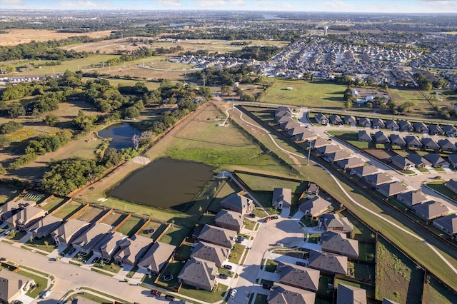 drone / aerial view with a residential view and a water view