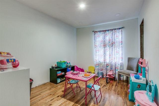 playroom with light wood-style flooring