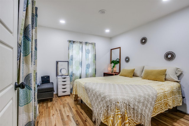 bedroom featuring recessed lighting and wood finished floors