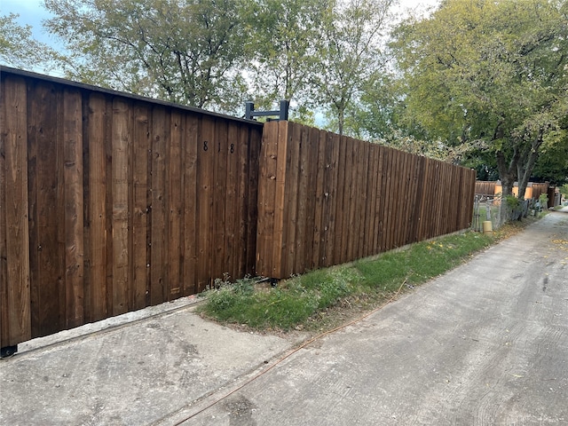 view of gate with fence