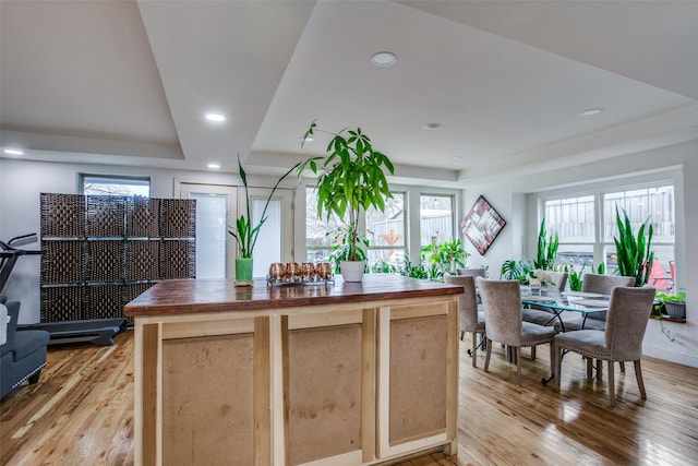 kitchen with recessed lighting, wood counters, light brown cabinetry, and light wood finished floors