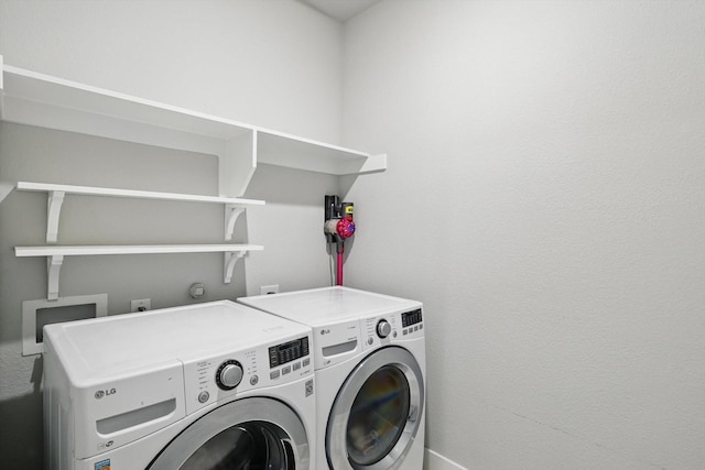 laundry area featuring laundry area and washing machine and clothes dryer