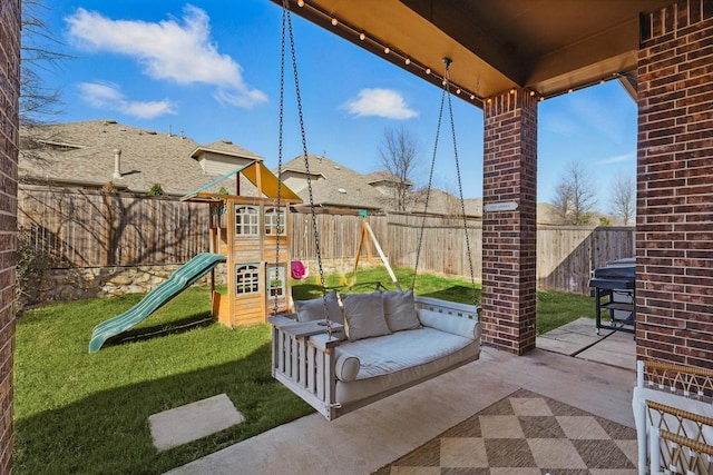 view of patio / terrace featuring an outdoor living space, a playground, and a fenced backyard