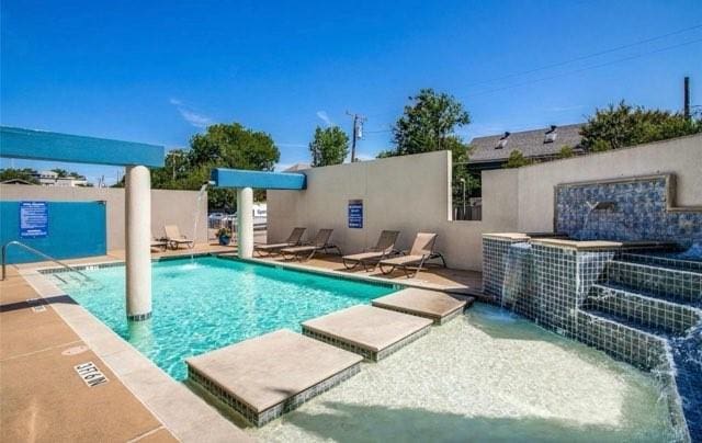 pool featuring a patio and fence