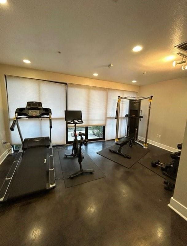 exercise room featuring recessed lighting and baseboards