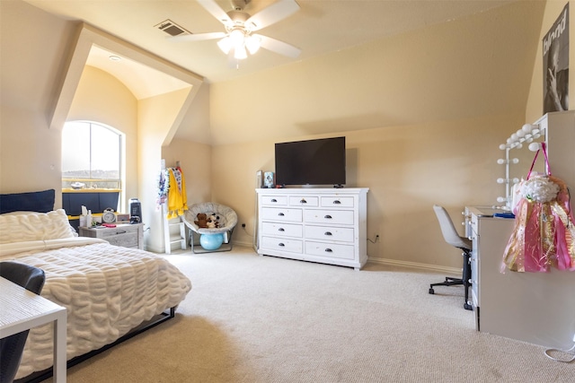 carpeted bedroom with visible vents, lofted ceiling, and baseboards