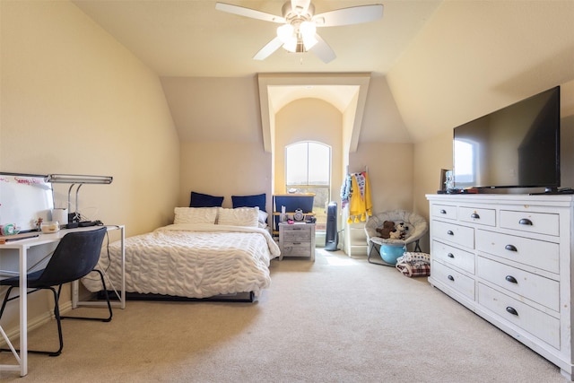 carpeted bedroom with lofted ceiling and a ceiling fan