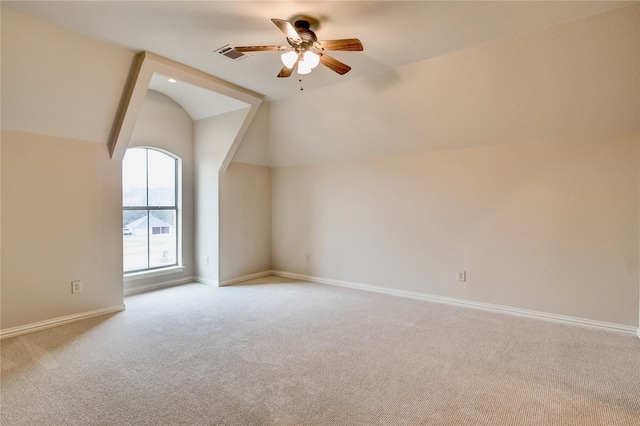 bonus room with baseboards, carpet floors, ceiling fan, and vaulted ceiling