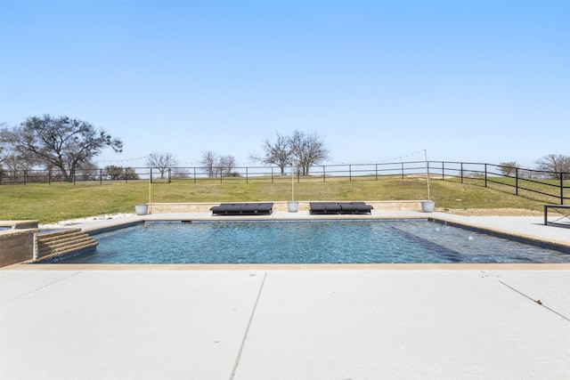 view of pool featuring a yard, a patio area, and a fenced backyard