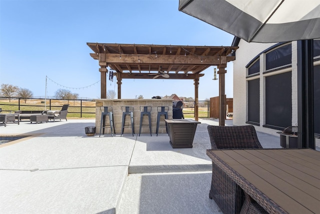 view of patio / terrace with a pergola, outdoor dry bar, outdoor dining space, and fence