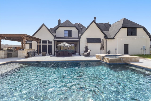 back of house with outdoor dry bar, a pergola, outdoor lounge area, an outdoor kitchen, and a patio area