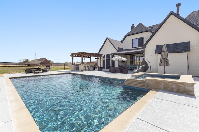 pool with outdoor dry bar, a patio, fence, exterior kitchen, and an in ground hot tub