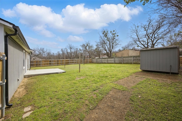 view of yard with a fenced backyard, a patio area, a storage shed, and an outdoor structure