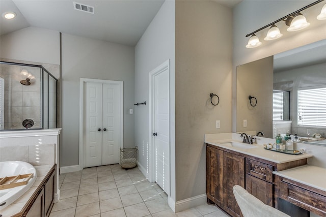 full bathroom with visible vents, a garden tub, vaulted ceiling, a stall shower, and tile patterned floors