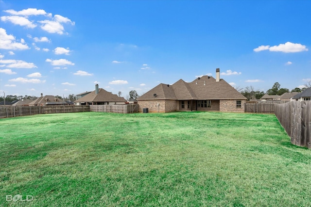 view of yard with a fenced backyard