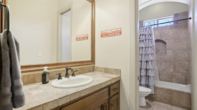 bathroom with tile patterned flooring, toilet, and vanity