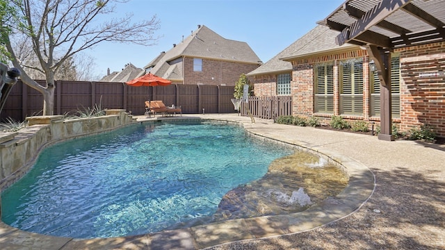 view of swimming pool featuring a patio area, a fenced in pool, and a fenced backyard