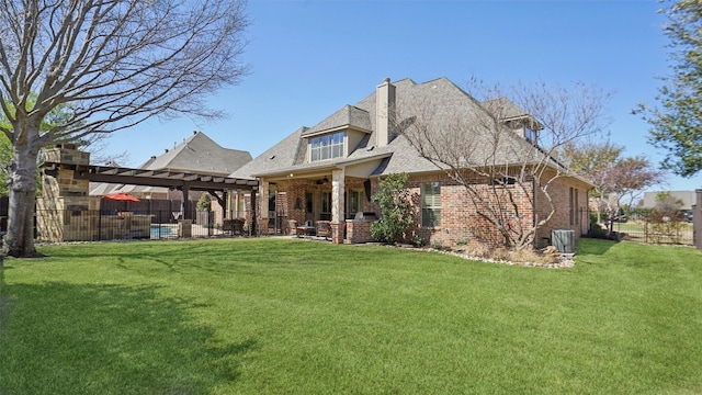 rear view of house featuring brick siding, fence, a lawn, a patio area, and a pergola