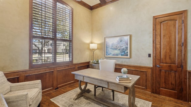 home office featuring a wainscoted wall, dark wood-style floors, and ornamental molding