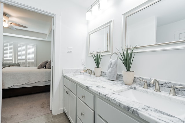 full bath featuring a sink, ensuite bath, double vanity, and ceiling fan