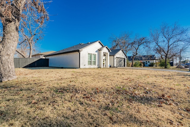 view of front of home featuring brick siding, a front yard, and fence