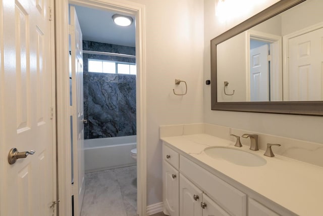 bathroom with vanity, toilet, and bathtub / shower combination